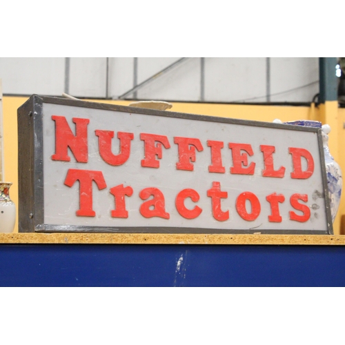 72 - AN ILLUMINATED NUFFIELD TRACTORS SIGN - 74 X 27 CM