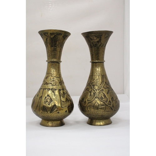 105 - A PAIR OF MIDDLE EASTERN BRASS VASES, HEIGHT 29CM