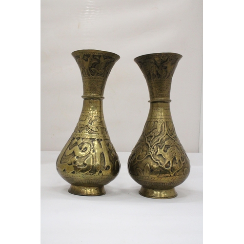 105 - A PAIR OF MIDDLE EASTERN BRASS VASES, HEIGHT 29CM