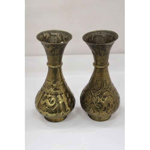 105 - A PAIR OF MIDDLE EASTERN BRASS VASES, HEIGHT 29CM