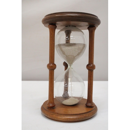 237 - A LARGE WOODEN GLASS EGG TIMER