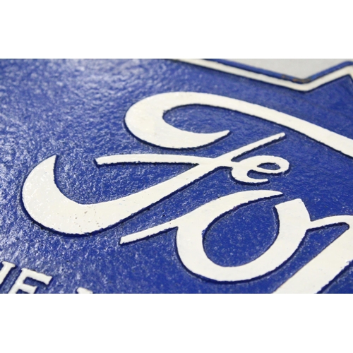 296 - A CAST BLUE FORD SIGN, 38CM X 16CM