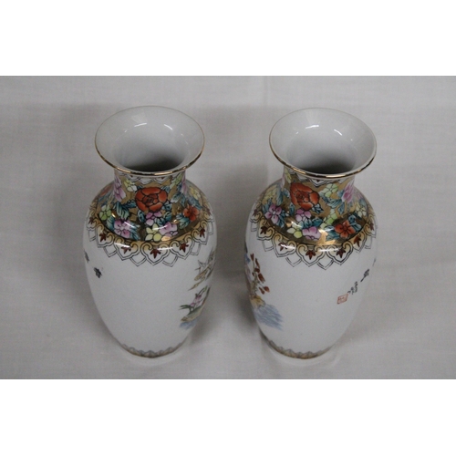 313 - A PAIR OF JAPANESE FAMILLE ROSE GEISHA VASES - 16 CM (H)