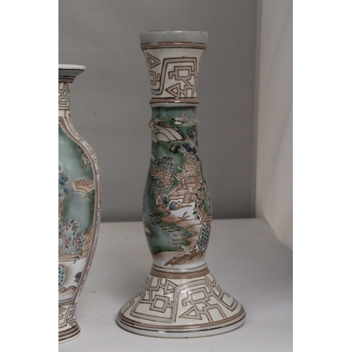 335 - A VINTAGE CHINESE ENAMELLED PORCELAIN VASE TOGETHER WITH A PAIR OF MATCHING CANDLESTICKS BOTH WITH R... 