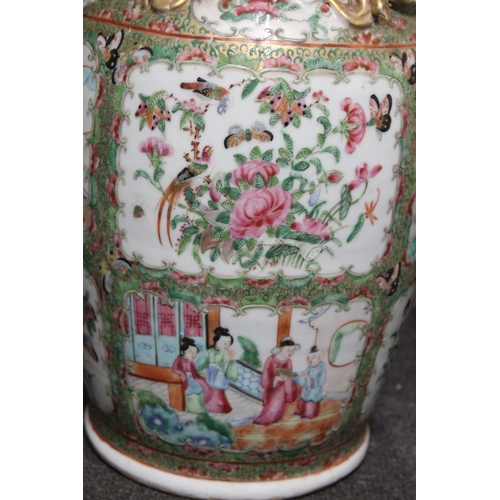 337 - A PAIR OF 19TH CENTURY CHINESE CANTON FAMILLE ROSE PORCELAIN VASES WITH BUDDHIST LION HANDLES AND GO... 