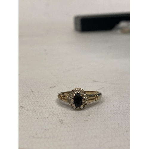 471 - A 9 CT GOLD RING WITH WITH SAPPHIRE AND DIAMONDS - 3.0 G