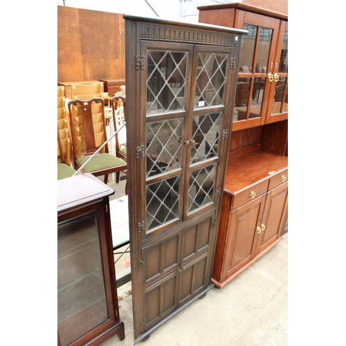 2806 - AN OAK FOUR DOOR CORNER CUPBOARD WITH GLAZED AND LEADED UPPER PORTION, 28