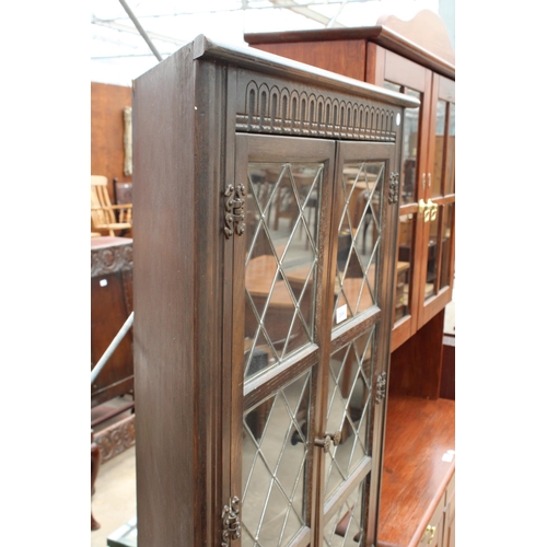 2806 - AN OAK FOUR DOOR CORNER CUPBOARD WITH GLAZED AND LEADED UPPER PORTION, 28