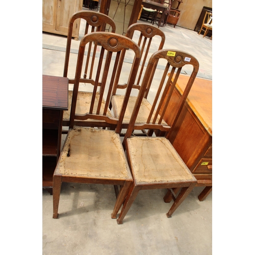 2818 - A SET OF FOUR EARLY 20TH CENTURY OAK DINING CHAIRS ON TAPERING LEGS