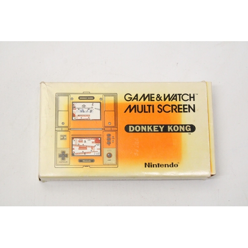 341 - A VINTAGE NINTENDO GAME AND WATCH MULTI SCREEN DONKEY KONG GAME IN ORIGINAL BOX - VENDOR STATES IN W... 