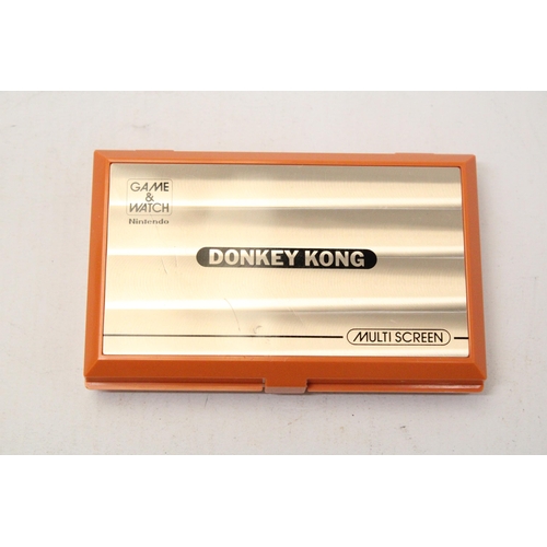 341 - A VINTAGE NINTENDO GAME AND WATCH MULTI SCREEN DONKEY KONG GAME IN ORIGINAL BOX - VENDOR STATES IN W... 