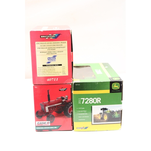 403 - THREE BRITAINS 1:32 SCALE VEHICLES TO INCLUDE A JOHN DEERE 2011 7280R TRACTOR, AN INTERNATIONAL HARV... 