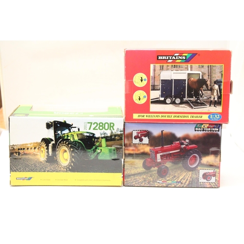 403 - THREE BRITAINS 1:32 SCALE VEHICLES TO INCLUDE A JOHN DEERE 2011 7280R TRACTOR, AN INTERNATIONAL HARV... 