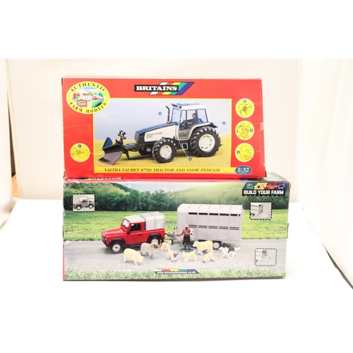 412 - TWO BRITAINS 1:32 SCALE MODELS TO INCLUDE A VALTRA VALMET 8750 TRACTOR AND SNOW PLOUGH PLUS A LAND R... 