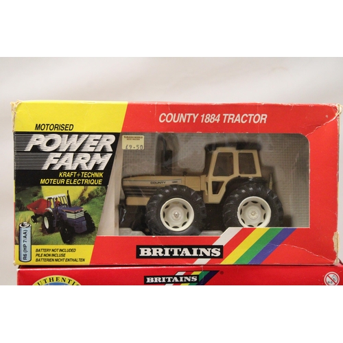 431 - THREE BRITAINS 1:32 SCALE MODELS TO INCLUDE A MOTORISED COUNTY 1884 TRACTOR, A TWIN AXLE FLAT BED TR... 