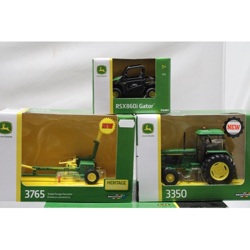 453 - THREE BRITAINS 1:32 SCALE JOHN DEERE MODELS TO INCLUDE A 3350 TRACTOR, A MOWER CONDITIONER, A TRAILE... 