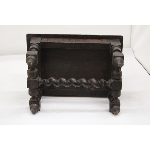 121 - A SMALL HAND CARVED KETTLE/ FOOT STOOL