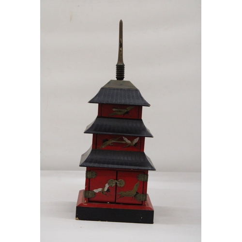 125 - A WOODEN JEWELLERY/MUSIC BOX - THREE STOREY PAGODA - APPROXIMATELY 40CM HIGH