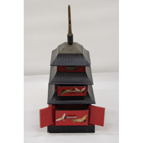 125 - A WOODEN JEWELLERY/MUSIC BOX - THREE STOREY PAGODA - APPROXIMATELY 40CM HIGH