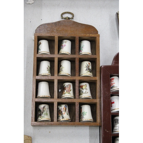 142 - A LARGE QUANTITY OF THIMBLES IN DISPLAY CASES PLUS GLASS 