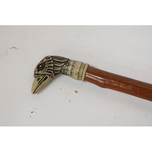 23 - A WALKING CANE WITH A SILVER FINIAL