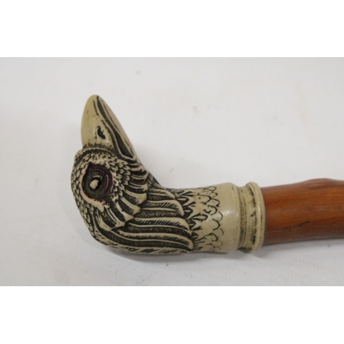 23 - A WALKING CANE WITH A SILVER FINIAL