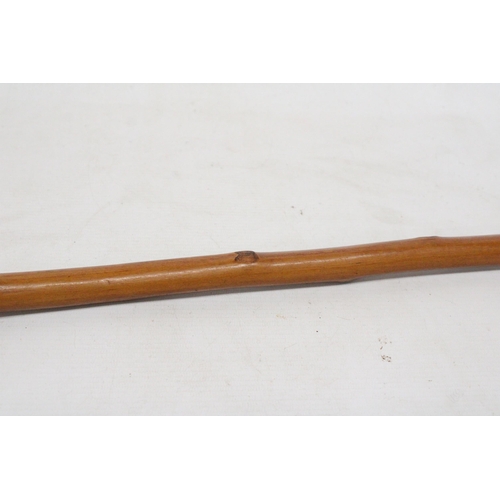 23 - A WALKING CANE WITH A SILVER FINIAL