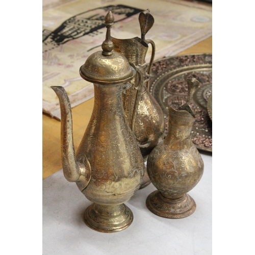 38 - TWO BRASS ETCHED EWERS WITH SERPENT HANDLE TOGETHER WITH A MIDDLE EASTERN BRASS DALLAH COFFEEPOT