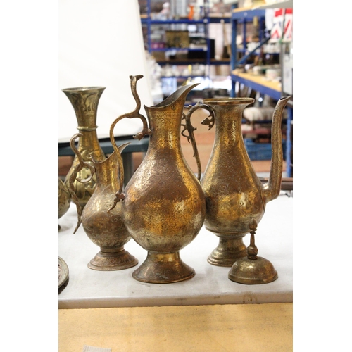 38 - TWO BRASS ETCHED EWERS WITH SERPENT HANDLE TOGETHER WITH A MIDDLE EASTERN BRASS DALLAH COFFEEPOT