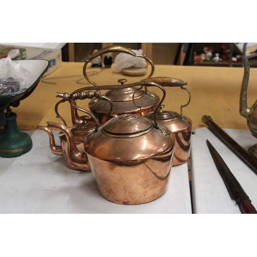 40 - FOUR GRADUATED COPPER KETTLES