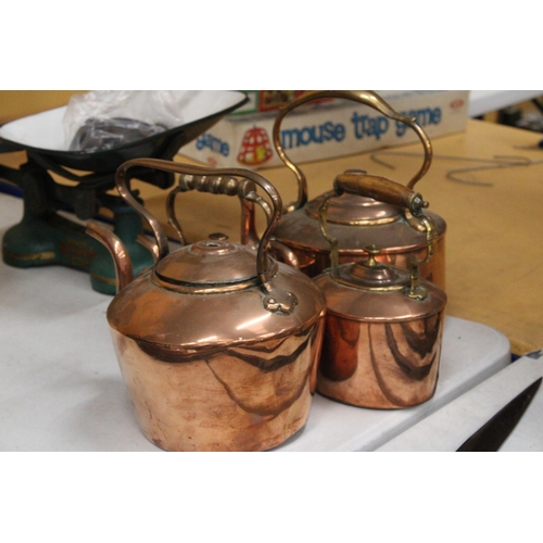 40 - FOUR GRADUATED COPPER KETTLES