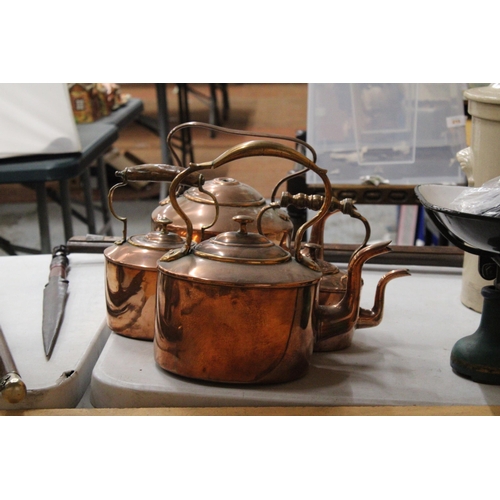 40 - FOUR GRADUATED COPPER KETTLES