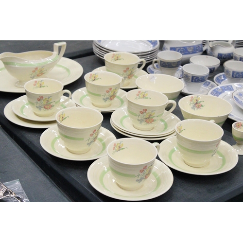 151 - A FLORAL TEA SET TO INCLUDE SEVEN CUPS AND SAUCERS, TWO SUGAR BOWLS, GRAVY JUG ETC