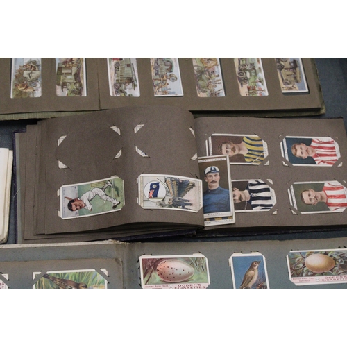 158 - A QUANTITY OF VINTAGE CIGARETTE CARDS IN ALBUMS TO INCLUDE OGDENS AND WILLS TOGETHER WITH A FURTHER ... 