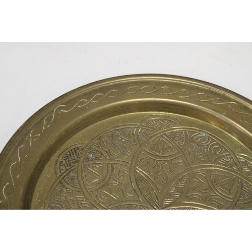 163 - A BRASS ARTS AND CRAFTS STYLE WALL PLAQUE, DIAMETER  25CM