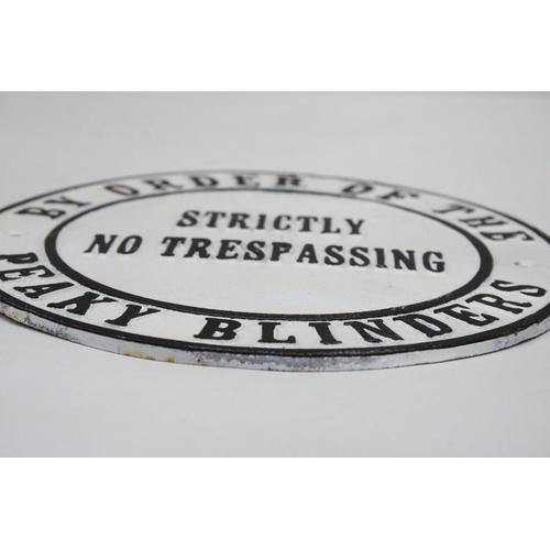 167 - A CAST PEAKY BLINDERS SIGN - NO TRESSPASSING, DIAMETER 24CM