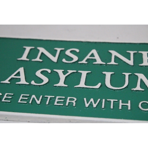 168 - A CAST INSANE ASYLUM SIGN, 27CM X 13CM