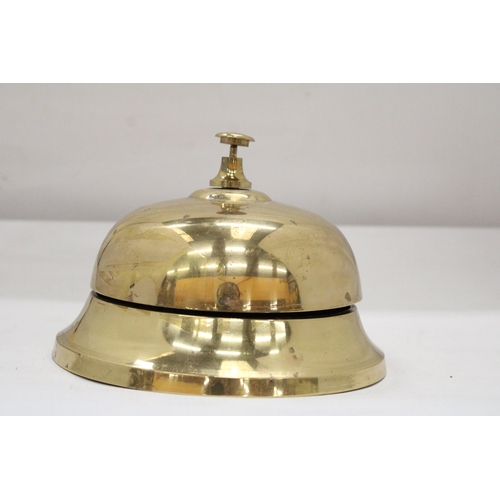 187 - A LARGE BRASS DESK BELL - 7 INCH DIAMETER