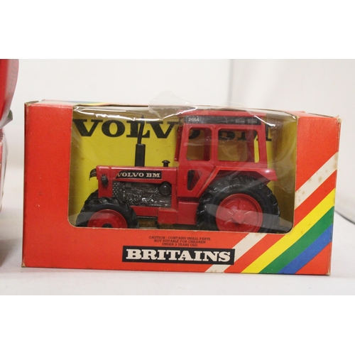 486 - THREE VINTAGE BRITAINS FARM VEHICLES TO INCLUDE A VOLVO TRACTOR, CAT. NO. 9521, A BALE SLEDGE, CAT. ... 