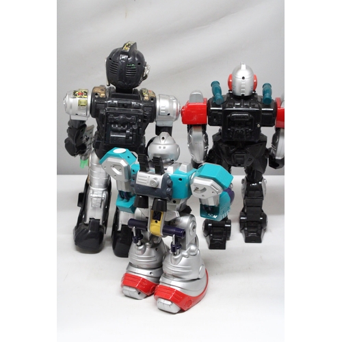 294 - THREE LARGE TOY ROBOTS