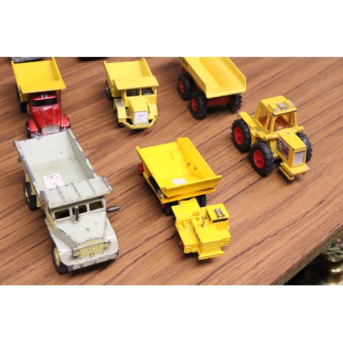 377 - A COLLECTION OF VINTAGE MATCHBOX TOYS TO INCLUDE FOUR SCAMMELL DUMP TRUCKS, A UCKLID DUMP TRUCK, FOD... 