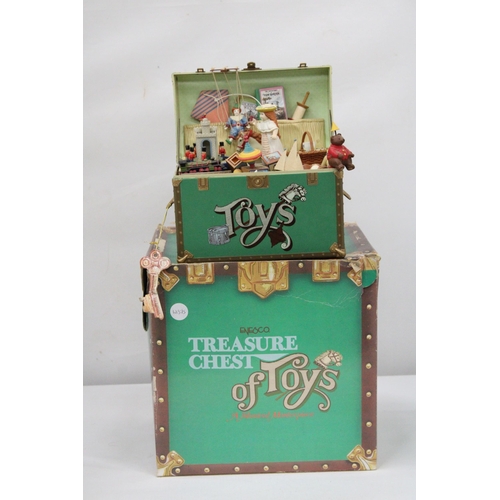 391 - AN ENESCO 'TREASURE CHEST OF TOYS' MUSICAL MASTERPIECE - BOXED