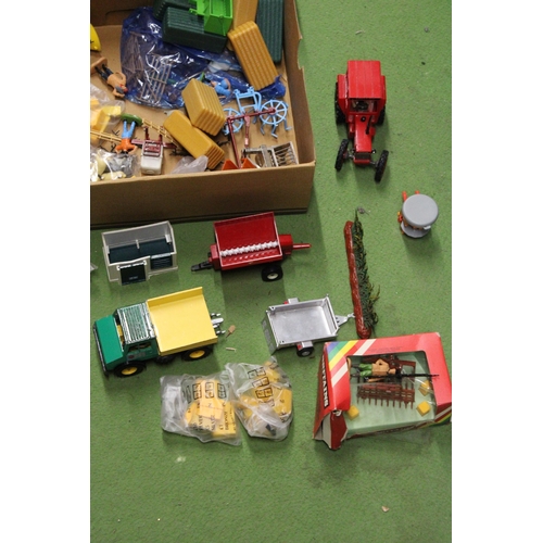 534 - A QUANTITY OF BRITAINS FARMYARD MODELS AND ACCESSORIES TO INCLUDE A TRACTOR, TRAILERS, FARMYARD IMPL... 