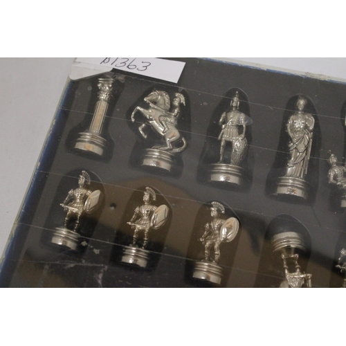 559 - A BOXED SET OF METAL ROMAN STYLE CHESS PIECES