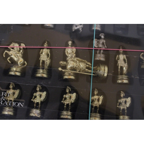 559 - A BOXED SET OF METAL ROMAN STYLE CHESS PIECES