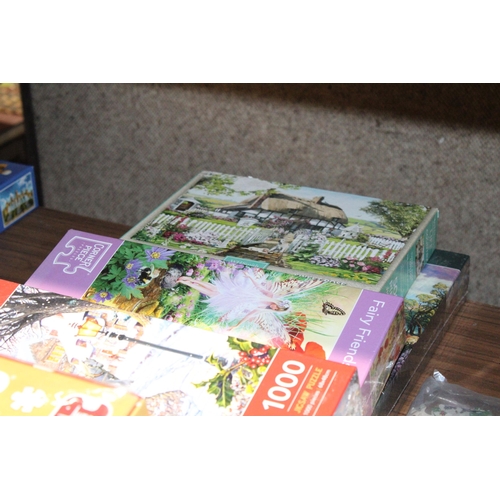 563 - A COLLECTION OF NINE JIGSAW PUZZLES - 5 1000 PIECES AND FOUR 500 PIECES - FIVE AS NEW AND SEALED, PL... 