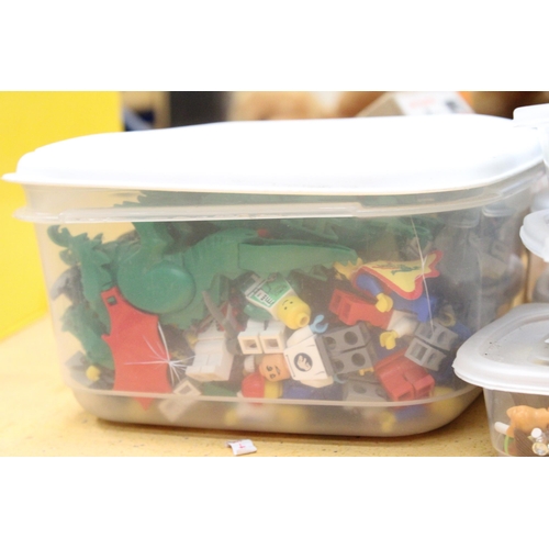 569 - A LARGE QUANTITY OF LEGO FIGURES AND ACCESSORIES IN 7 STORAGE CONTAINERS