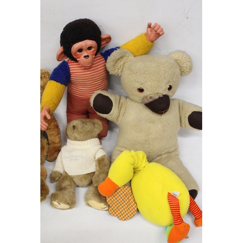 574 - A COLLECTION OF SOFT TOYS TO INCLUDE RUSS TEDDIES, A LARGE MONKEY, ETC