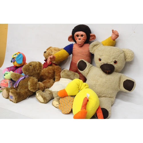 574 - A COLLECTION OF SOFT TOYS TO INCLUDE RUSS TEDDIES, A LARGE MONKEY, ETC