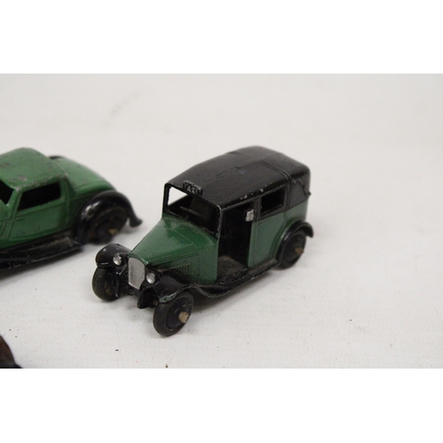 589 - FOUR VINTAGE DINKY MODELS TO INCLUDE A POST WAR BENTLEY, A PRE-WAR TAXI, A POST WAR HUMBER VOGUE AND... 